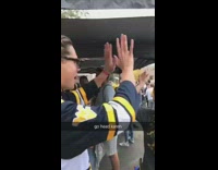 Mom shotguns beer can with her daughter at tailgate party