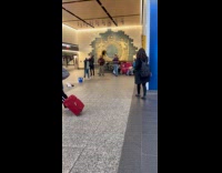 Man dances to band performing at station