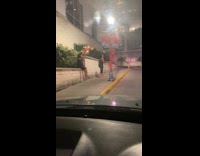 Woman black dress photographer sit ledge balloons