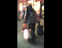 Music Bat Guy Carries Chuckie The Doll Toy in H and M Bag