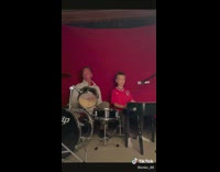 Dad and son recreate photo with drums and piano 