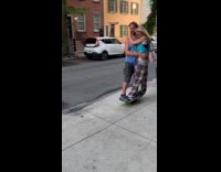 Couple ride Onewheel board together on street