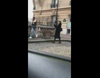 Girl jacket hold cup walk Eiffel tower