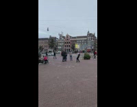 Man in black vest dance on the street park