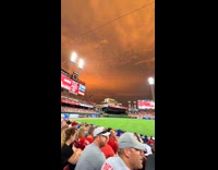Orange sunset sky baseball game