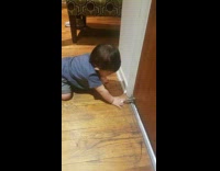 Baby loves to play with door stop