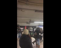 Old man dances crazy with young woman in subway station to live band