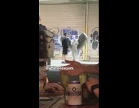 Guy dressed as white devil angel is seen across restaurant 