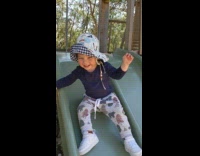 Toddler girl falls off side of slide 