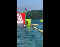 Guy double backflip inflatable obstacle course lake 