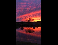 Beautiful sunset clouds reflected on the water