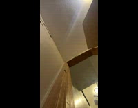 Girl drops phone then runs into wall