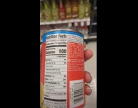 Guy looks at nutrition label refried beans 