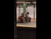 Man Uses Typewriter as he Waits for Train