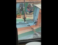 Girl lean back colorful striped wall ground