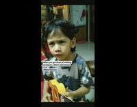 Kid sings christmas song and plays guitar 