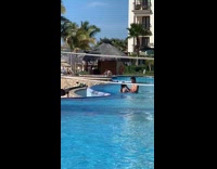 Girl red white bikini lifts body pool 