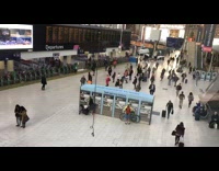Time lapse Waterloo Train Station blue kiosk  