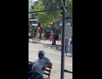 Man walks robot dog on the street
