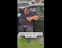 Guy in grey shirt tries to squeeze out of car and hits horn 