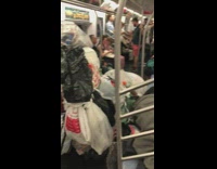 trash bags and trash in subway car man sleeping