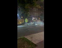 Smoke from pile of trash on road