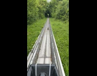 Man riding toboggan chases rabbit away