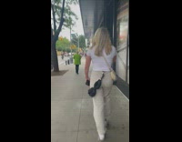 Girl walks with umbrella hook on belt loop