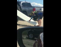 Collab Kook Of The Day - Yellow Helmet Guy Waxes White Surfboard Out of Back Car