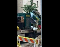 Shirt hanging from fan on green truck