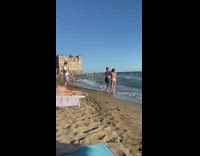Man and Woman in beach wear danced at the beach