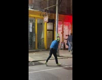 Guy hits golf on the street and fails