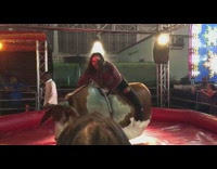 Girl in red flannel rides mechanical bull ride, faceplants bull and falls off