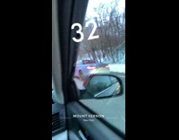 Guy drives convertible car by snow 