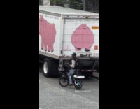 Guy riding bike does karaoke on street