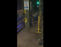 Bicycle at subway station near tracks railing 