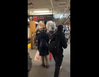 Man carries plastic bag inside the subway