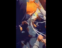 Friends drink beer pumpkin bong garage party