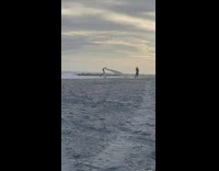 Person wearing bodysuit runs with blanket  