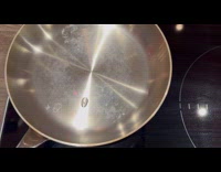 Guy shows water droplet swirls inside pan