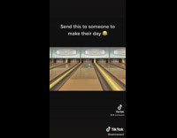 Guy plays wii bowling gets strike nice 