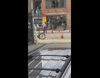 Girl silver bra purple pants walk street