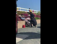 Woman blue sweater lie down bushes hold hands