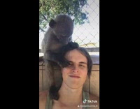 man with monkey on shoulder nose