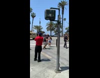 Two people face mask jump shot military vehicle