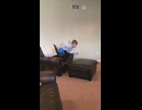 Little boy jumps from couch too ottoman, bounces off, face plant into blue ball and scorpions