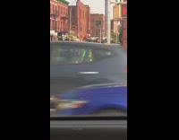Woman dances while serving as crossing guard