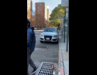 Scary mask on car parked on street