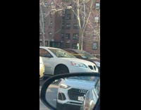 Sledgehammer left on broken windshield of parked car
