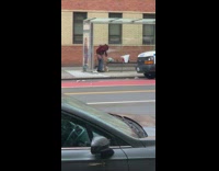 Red jacket guy wipes butt bus station